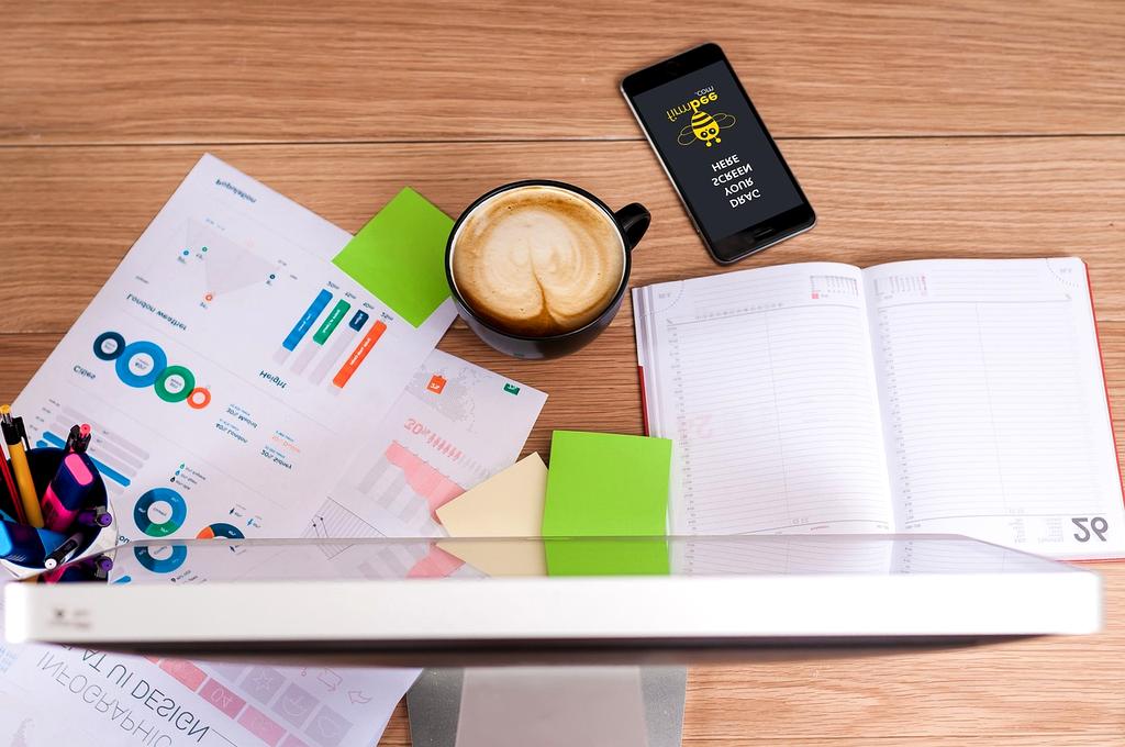 Open notebook and pen with a cup of coffee on desk symbolizing starting point
